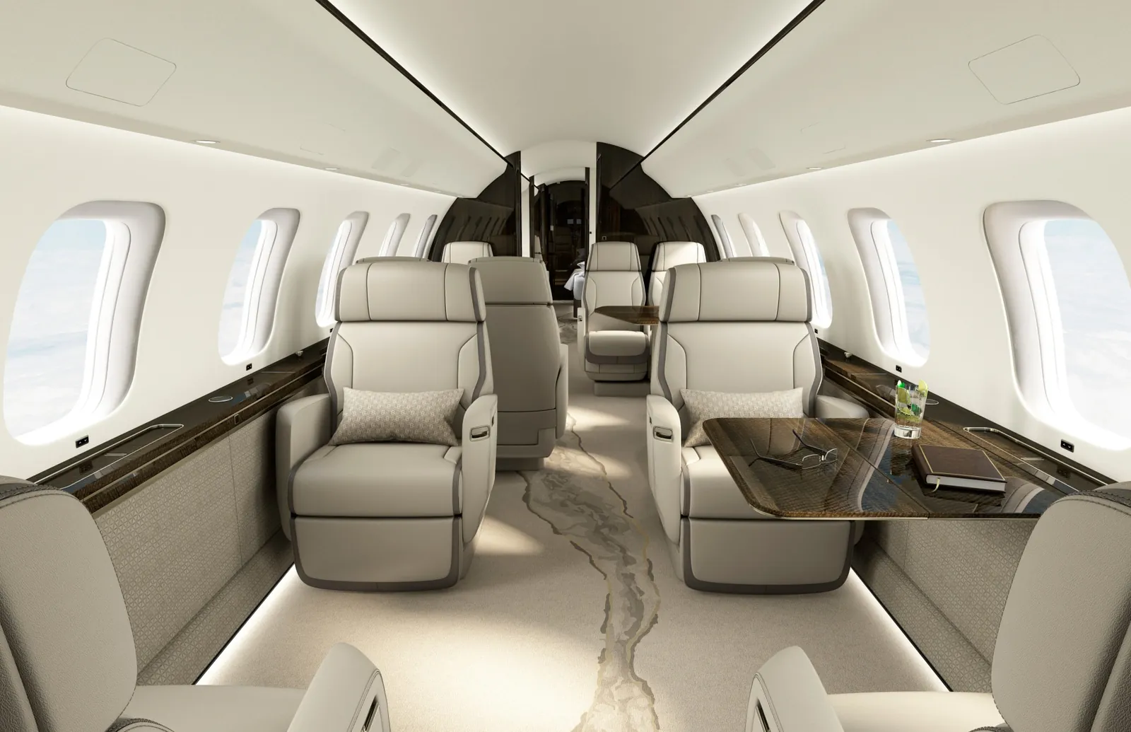 Kabine der Bombardier Global 8000 mit Clubsesseln und Tisch